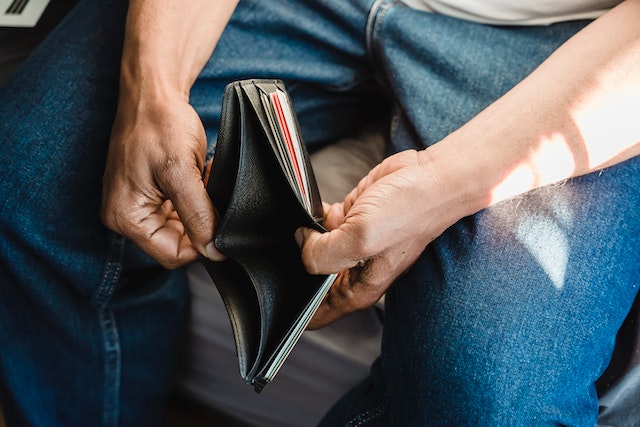 Empty wallet in man's hands