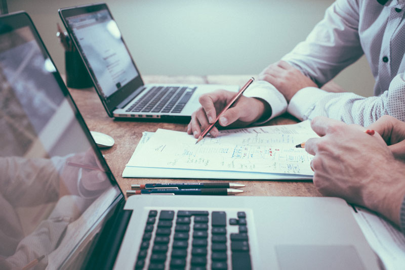 A financial advisor assisting his client.