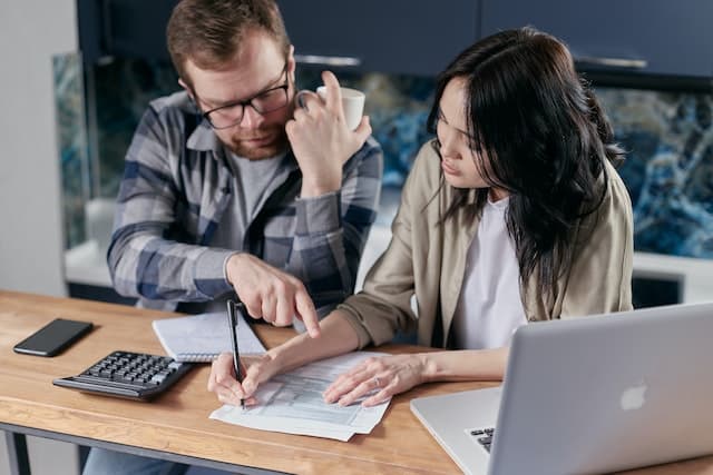 Person consulting a bankruptcy lawyer about how to deal with debt collectors